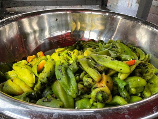 A large bowl of roasted green chilli at a market in Hatch, New Mexico. 