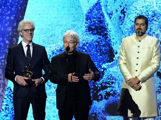 (L-R) US drummer and composer Stewart Copeland, record producer Herbert Waltl, and Indian composer Ricky Kej accept the award for Best Immersive Audio Album during the pre-telecast show of the 65th Annual Grammy Awards at the Crypto.com Arena in Los Angeles on February 5, 2023.
