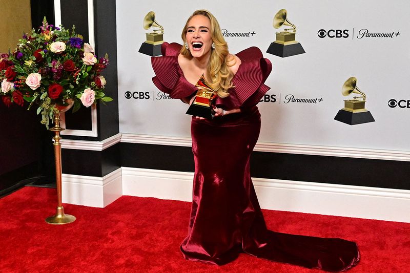 English singer-songwriter Adele poses with the award for Best Pop Solo Performance for 