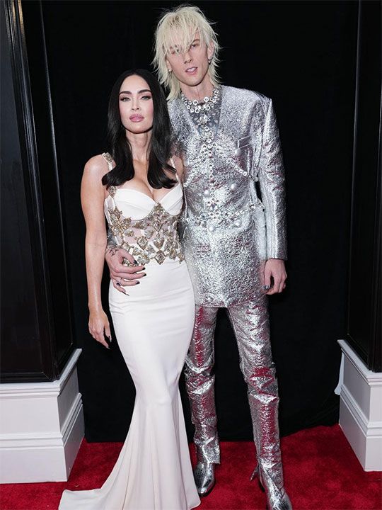 Machine Gun Kelly, who often pushes into edgy fashion. It was custom Dolce & Gabbana. He was accompanied by Megan Fox in creamy Zuhair Murad. Her gown had a corset bodice and heart embroidered applique.