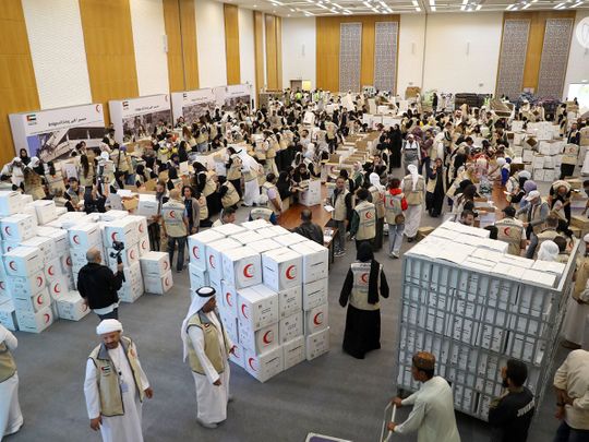 volunteers pack relief items for Turkey and Syria at ADNEC on Feb 11
