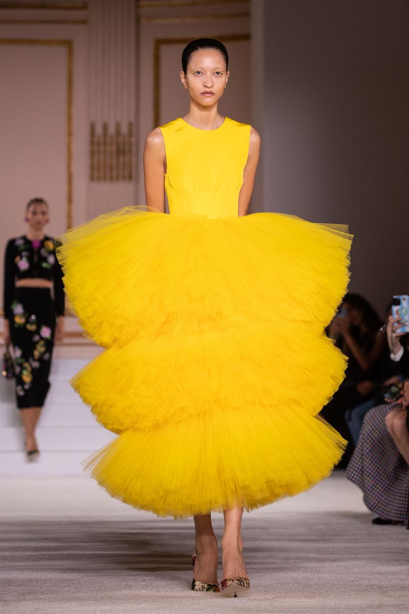 Gordon's signature Herrera aesthetic was on display in a yellow tulle dress with a tiered skirt that bounced as the model strutted down the ballroom. Another look that bought drama and intrigue was yet again a tiered black and white tulle dress — some of the nylon tulle covered the model's face, giving mystery to the look.