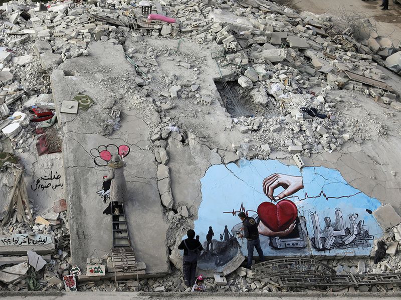 2023-02-22T212952Z_1336632692_RC2GGZ9WKD9V_RTRMADP_3_TURKEY-QUAKE-SYRIA-STREET-ART-(Read-Only)