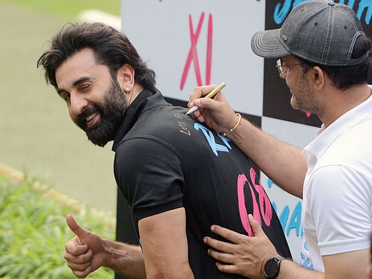  Bollywood actor Ranbir Kapoor shows a thumbs-up sign as former BCCI president Saurav Ganguly signs on his t-shirt, during the promotion of his new film 'Tu Jhoothi Main Makkaar', at Eden Gardens Stadium, in Kolkata on Sunday.