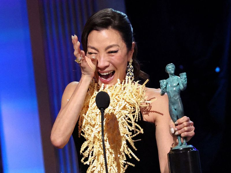 Michelle Yeoh gets emotional as she accepts the SAG Best Actress trophy