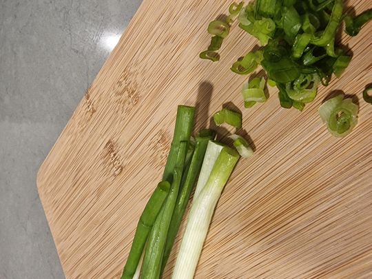 4. Chop the spring onions into small pieces, use both the green and white parts.