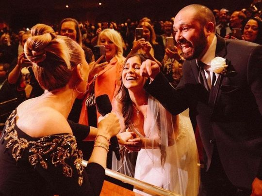 Adele signs fan's wedding dress at a concert in Las Vegas