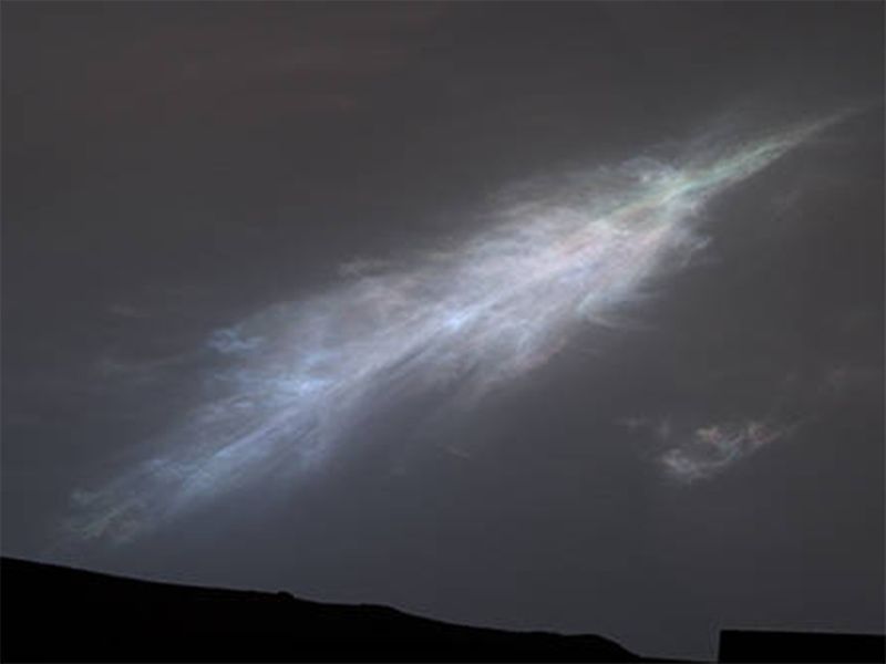 This feather-shaped iridescent cloud was captured just after sunset on January 27, 2023. 