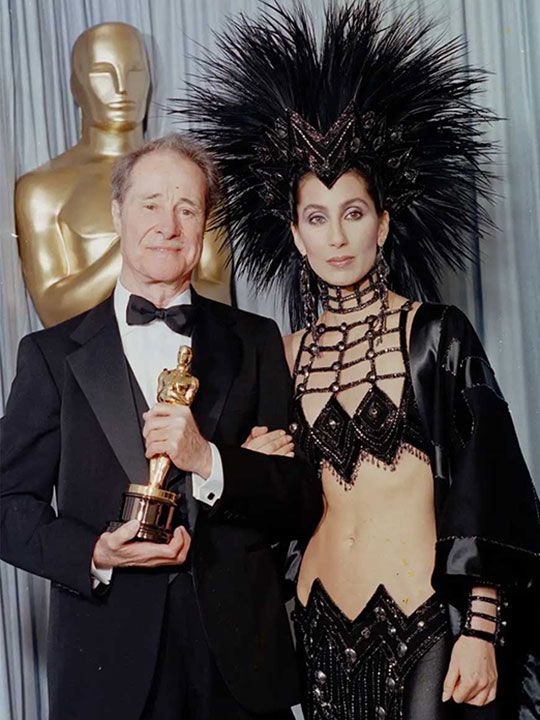 Actor Don Ameche holds the Oscar he received for best supporting actor for his role in 