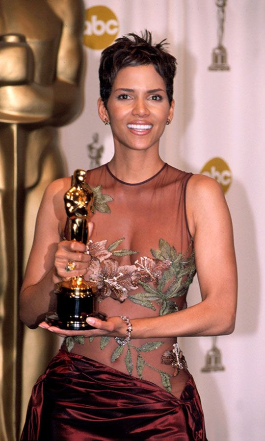 Halle Berry holding her Oscar at the Academy Awards. 