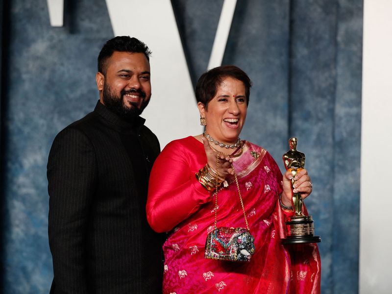 Achin Jain and Guneet Monga at the Oscars after-party.