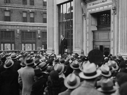 John Poole, president of the Federal American National Bank in Washington in 1933, spoke from a window ledge of the Perpetual Building Loan Association to assure worried shareholders that the Perpetual was a sound bank and that the rumor was caused by false and unfounded rumors. (AP Photo)