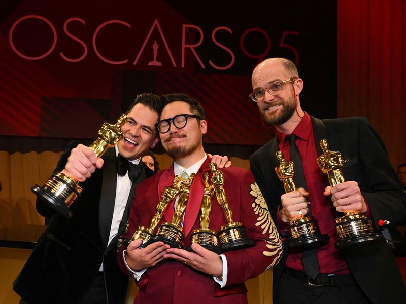 Jonathan Wang, Daniel Kwan and Daniel Scheinert pose with the Oscars