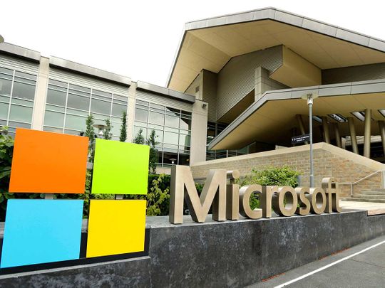 Microsoft logo is displayed outside the Microsoft Visitor Center in Redmond, Washington. Microsoft is infusing generative AI tools into its Office software, including Word, Excel and Outlook emails.