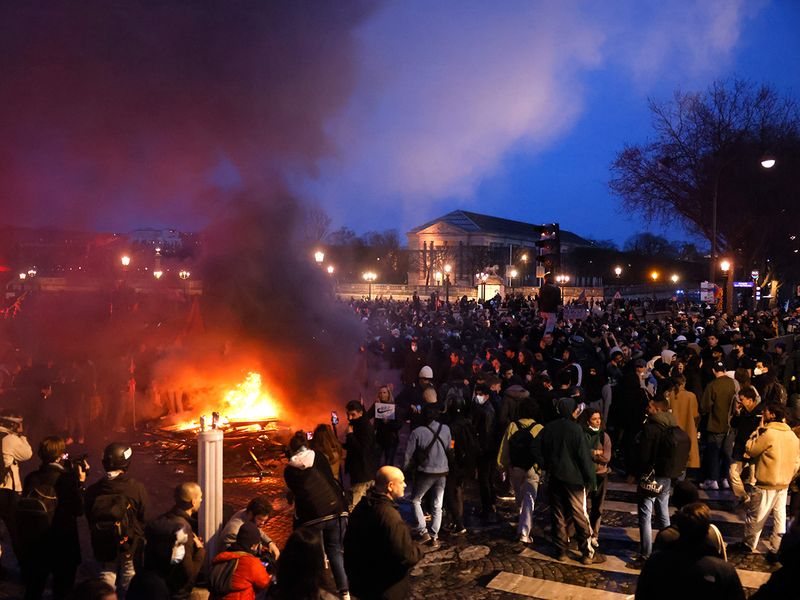 Pallets burn as protesters demonstrate at Concorde square near the National Assembly in Paris. 