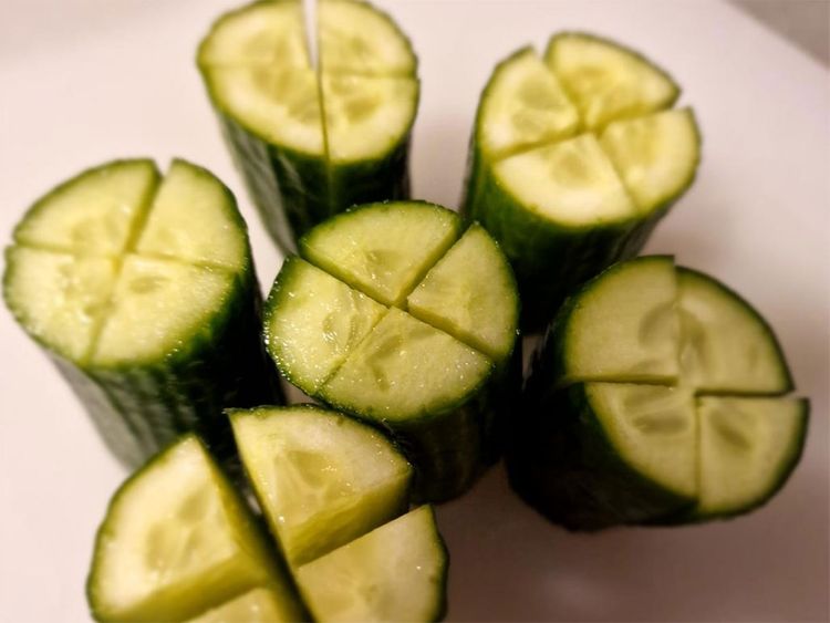 Cut the cucumber pieces lengthwise in a cross shape