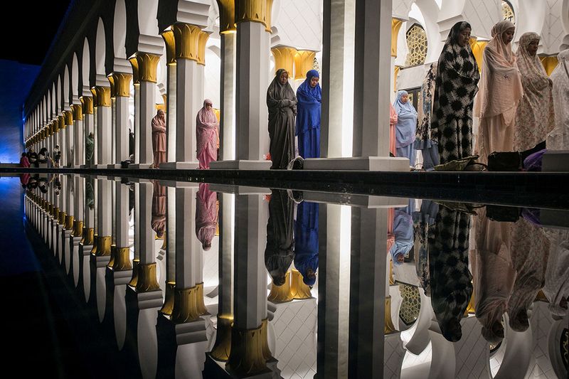 Muslim women offer 'Tarawih' mass prayers during the first evening of the holy fasting month of Ramadan at Sheikh Zayed Grand mosque in Solo, Central Java province, Indonesia, March 22, 2023.