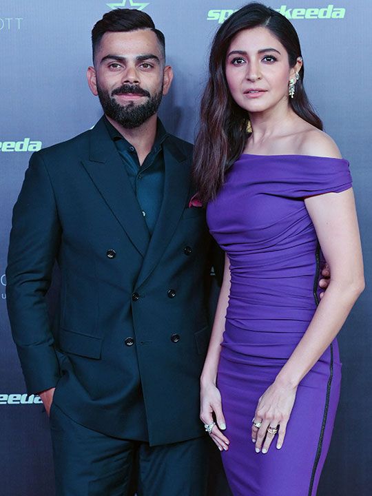 Indian cricketer Virat Kohli (L) and his wife Anushka Sharma pose during the 'Indian Sports Honours' in Mumbai on March 23, 2023. 