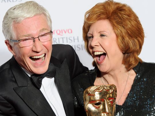 File photo of British TV stars Paul O'Grady and Cilla Black sharing a funny moment.