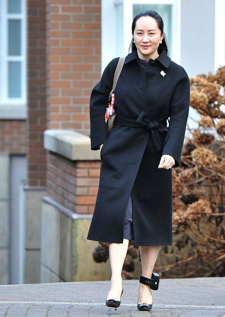 (FILE PHOTO) In this file photo taken on January 21, 2020, Huawei chief financial officer Meng Wanzhou leaves her Vancouver home for an extradition hearing at the British Columbia Supreme Court in Vancouver, British Colombia.  