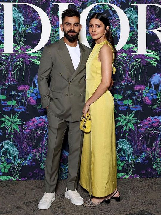Cricketer Virat Kohli and his wife and actress Anushka Sharma pose for a picture.