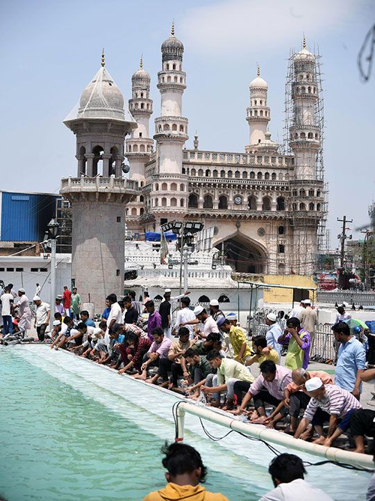 Devotees perform 'wudu' ritual before offering prayers (Namaz) during the month of Ramadan, in old city of Hyderabad on Friday.
