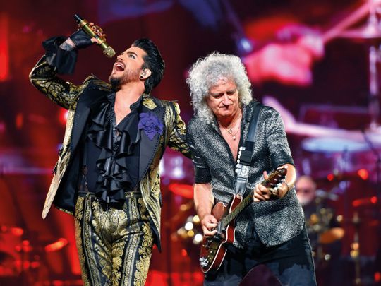 File photo of Adam Lambert and Brian May performing on stage.