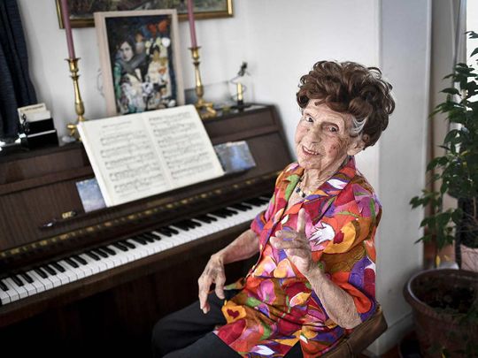 French pianist Colette Maze, 108 years-old, poses during a photo session in Paris on March 24, 2023.