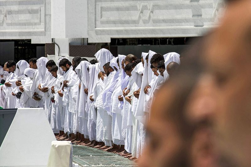 Muslim worshippers pray around the Kaaba.
