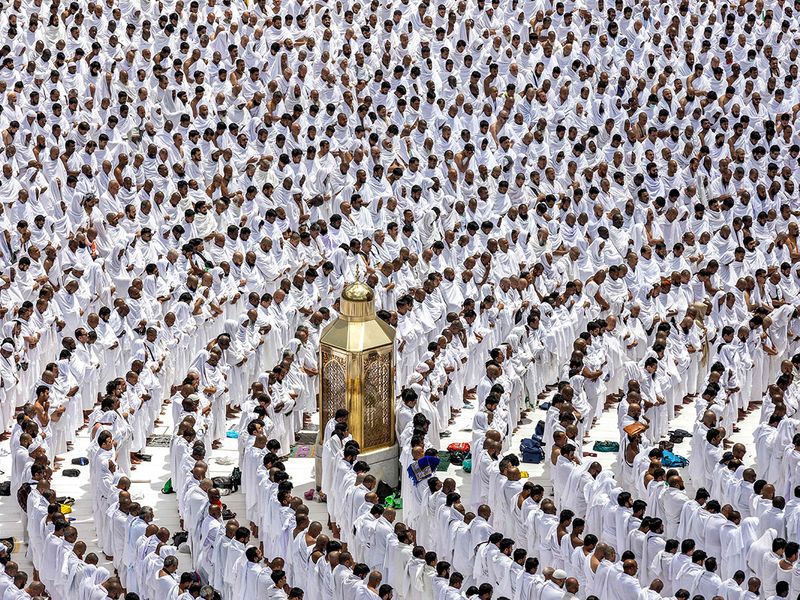 Muslim worshippers stand around Maqam Ibrahim (Station of Abraham) as they pray around the Kaaba (not pictured), Islam's holiest shrine, at the Grand Mosque in the holy city of Mecca during the second Friday prayers in the holy month of Ramadan on March 31, 2023.