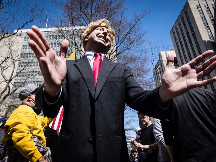 A Donald Trump impersonator appears