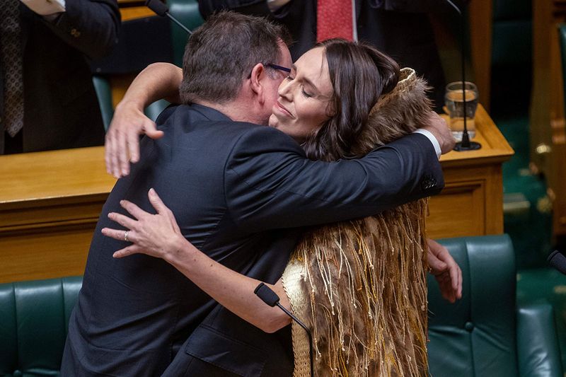 Jacinda Ardern, right, is hugged by Finance Minister Grant Robertson after Ardern made her final speech to New Zealand's Parliament in Wellington, on Wednesday, April 5, 2023, after her five-year tenure as prime minister. A global icon of the left and an inspiration to women around the world, Ardern in January stepped down as prime minister, saying “I know what this job takes, and I know that I no longer have enough in the tank to do it justice. It is that simple.