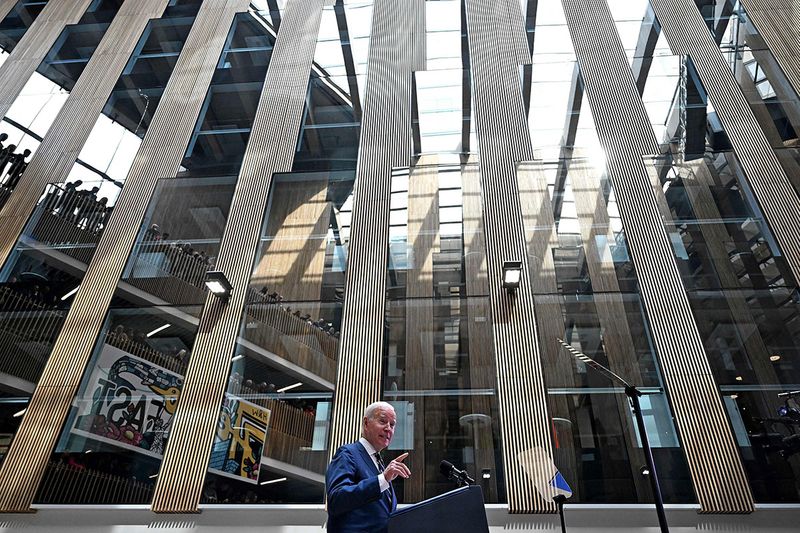 US President Joe Biden delivers a speech on business development at Ulster University in Belfast on April 12, 2023, as part of a four day trip to Northern Ireland and Ireland for the 25th anniversary commemorations of the 