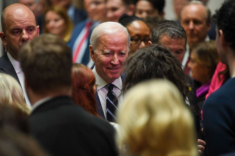 US President Joe Biden speaks to attendees after delivering a speech at Ulster University in Belfast, Northern Ireland, UK, on Wednesday, April 12, 2023. Biden will mark the 25th anniversary of the Good Friday Agreement, which largely brought about an end to decades of sectarian violence in Northern Ireland, and celebrate the recent Brexit deal intended to preserve that pact. 