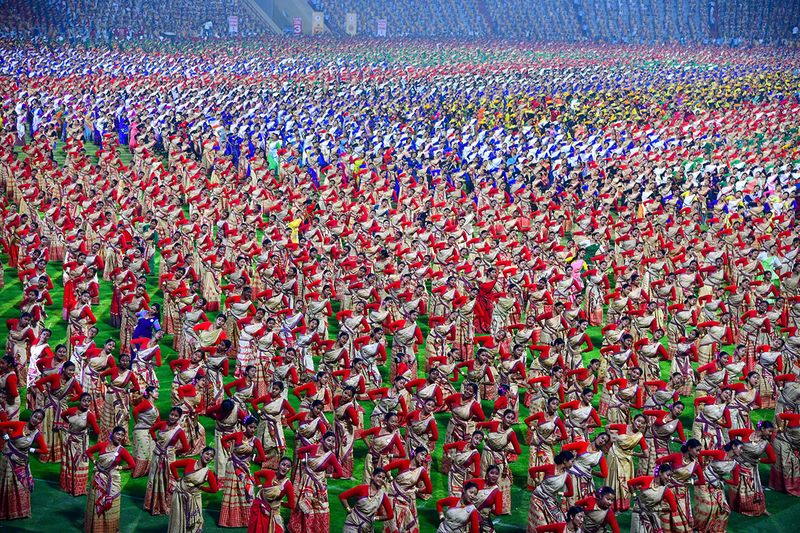 Bihu dancers perform to set a Guinness World Record at Sarusajai stadium in Guwahati on April 13, 2023. 