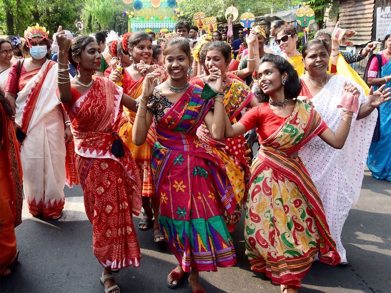 Young girls dressed up in traditional attires perform during a procession on the occasion of Bengali New Year or Pohela Boishakh, in Kolkata on Friday.