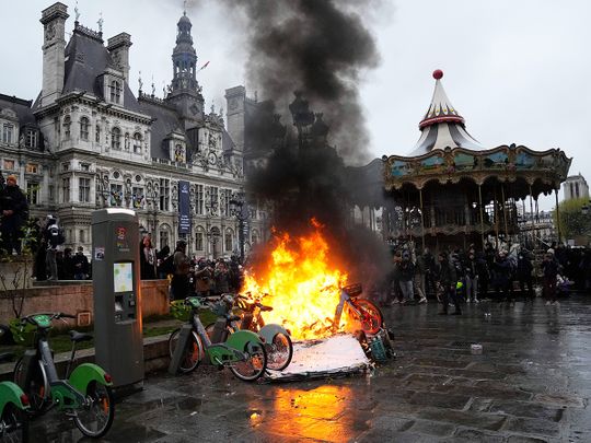 Bicycles burn during a protest outside the Paris City Hall.