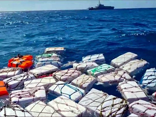Boxes containing cocaine float in the Sicilian Strait off Catania