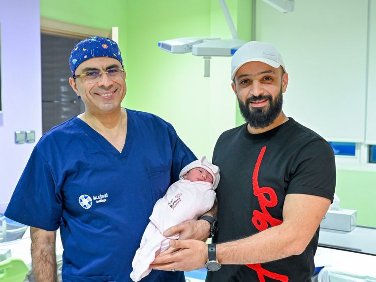 Baby girl Gazal with her father Ahmed Moheb and Dr. (Prof.) Walid El-Sherbiny at Medeor Hospital, Abu Dhabi.-1682052752057