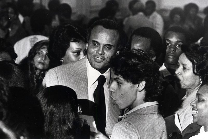 Harry Belafonte signs autographs for well-wishers in 1979.