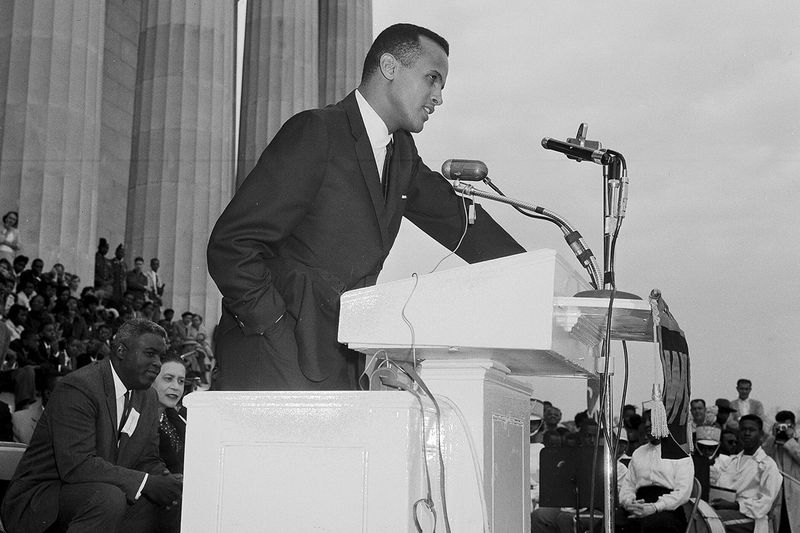 Harry Belafonte speaks to a crowd at the Lincoln Memorial in Washington during a youth march for integration, Oct. 25, 1958. 