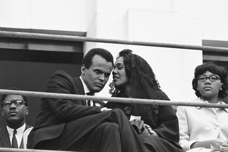 Singer and Civil Rights activist Harry Belefonte listens to Coretta Scott King, widow of the slain civil rights leader, in Memphis, Tennessee on April 8, 1968.