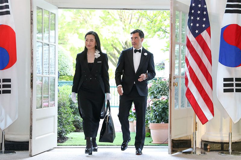 Korean-American author Min Jin Lee and her husband Christopher A. Duffy arrive for the official State Dinner held by U.S. President Joe Biden in honor of South Korea's President Yoon Suk Yeol at the White House in Washington, U.S. April 26, 2023.  