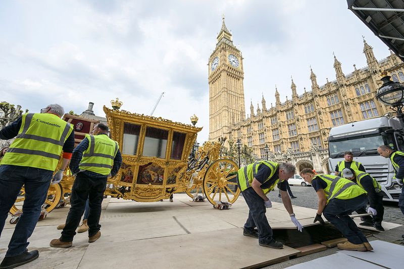  Workers transport the 17th century State Coach used by Speakers for ceremonial occasions to be on display at the Palace of Westminster to commemorate the coronation of Britain's King Charles, in London, Britain, in this undated handout photo.