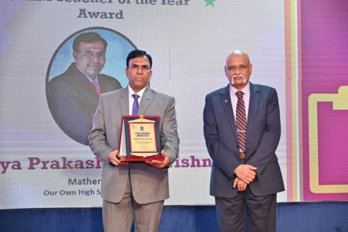 Udaya Prakash Balakrishna from Our Own High School, Dubai, winner of STEM Teacher of the year award with the Director of BPDC-1682952170155