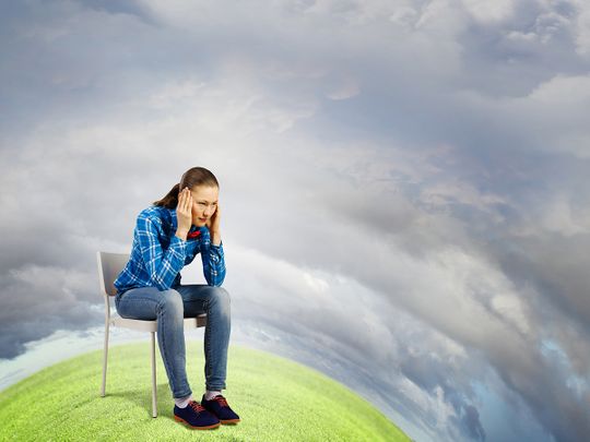 Person sitting on earth worried