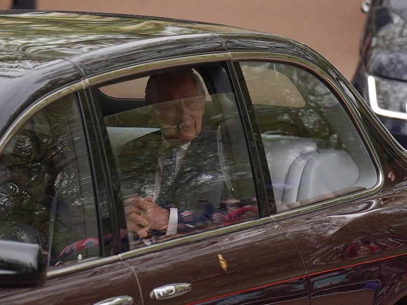 Britain's King Charles III and Britain's Camilla, Queen Consort drive up The Mall to Buckingham Palace at the start of the day, in central London, on May 6, 2023 ahead of their coronations.