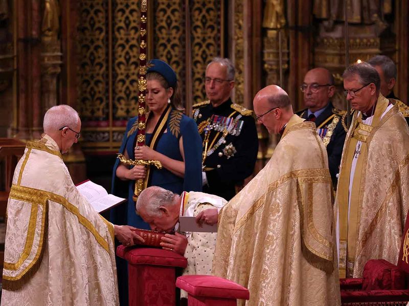 Britain's King Charles III kisses the Holy Bible during his coronation at Westminster Abbey, in central London on May 6, 2023.