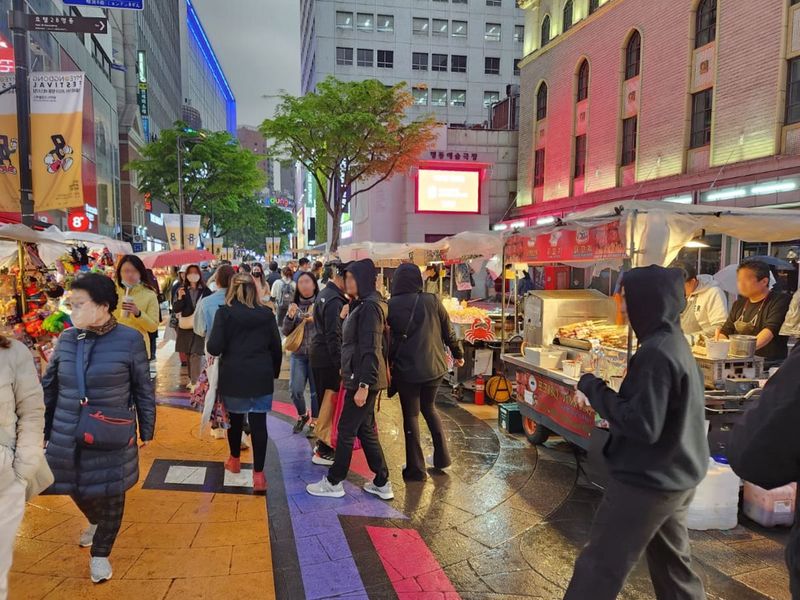 Tourists at Myeongdong Night Market in Seoul