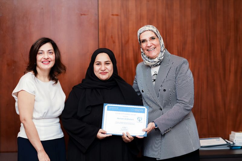 (centre) Mariam Al Dhaheri, senior medical laboratory technologist at National Reference Laboratory.